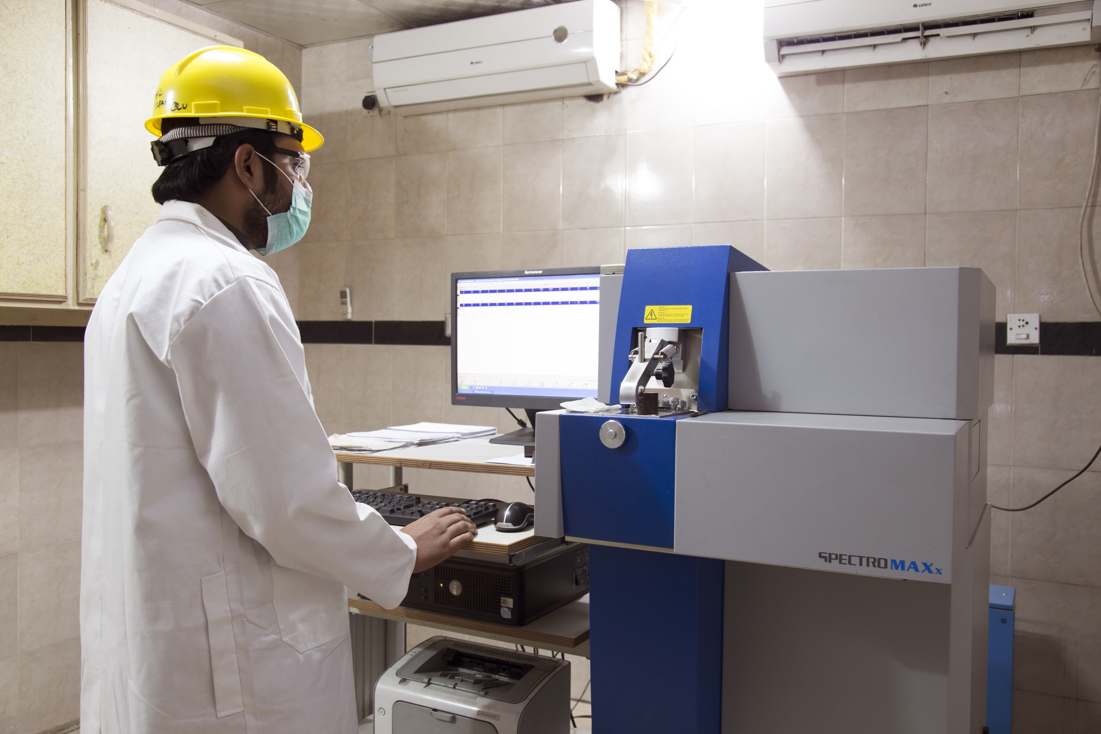 Technician running the Spectromaxx spectrometer at AFCO Steel